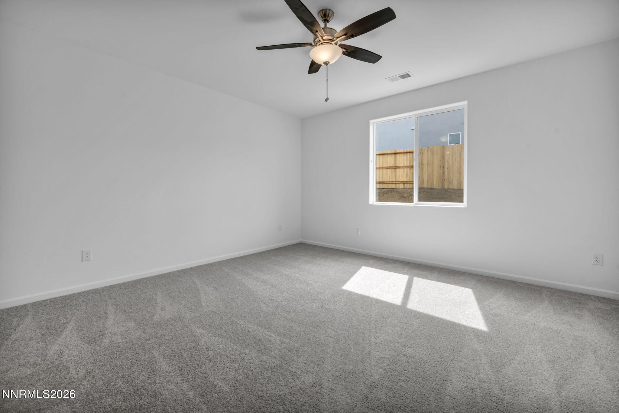 8500 Wicket Drive, Unit LOT 44 Reno, NV 89506 - Photo 18 of 31 a view of an empty room with a window