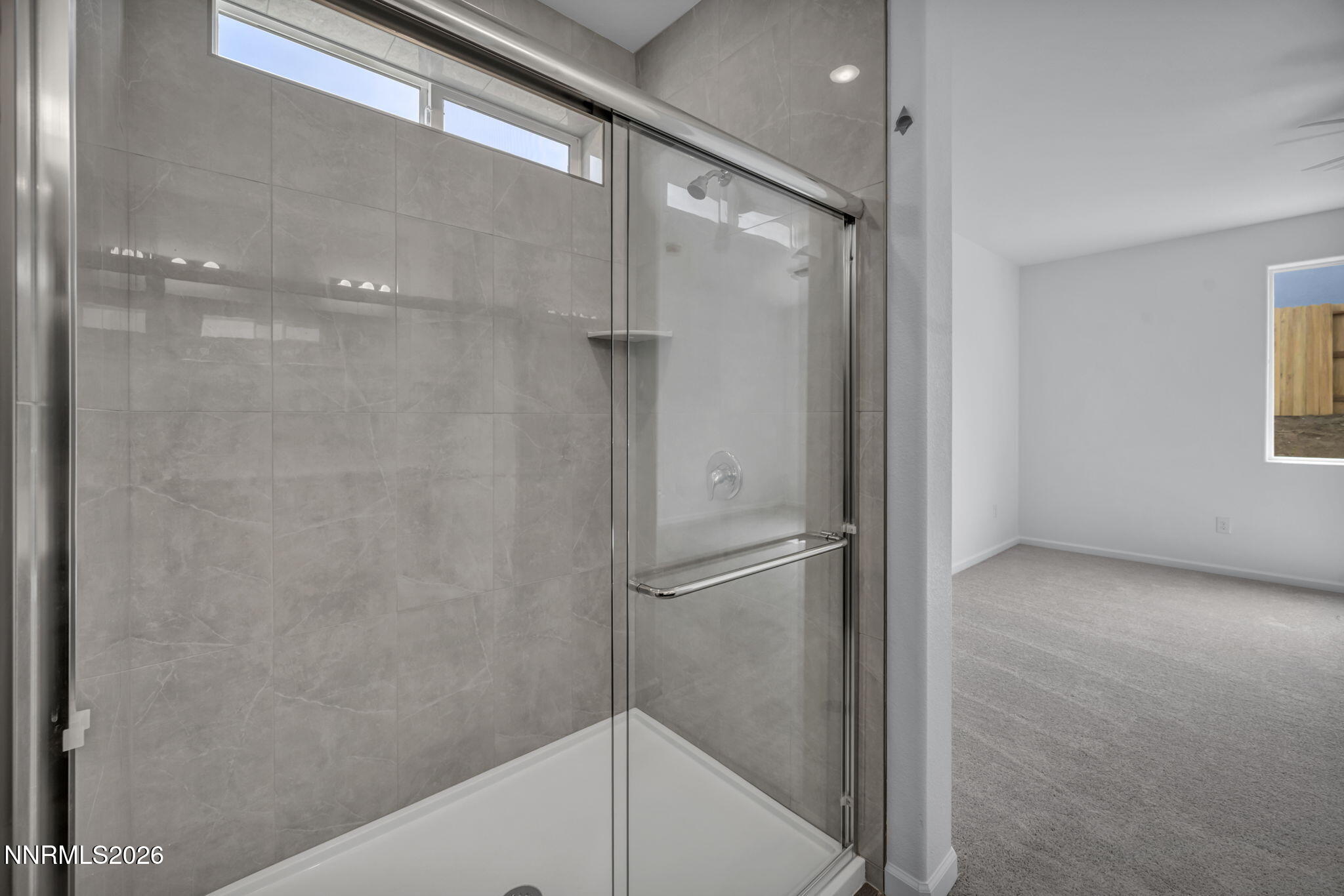 8500 Wicket Drive, Unit LOT 44 Reno, NV 89506 - Photo 23 of 31 a bathroom with a glass shower door