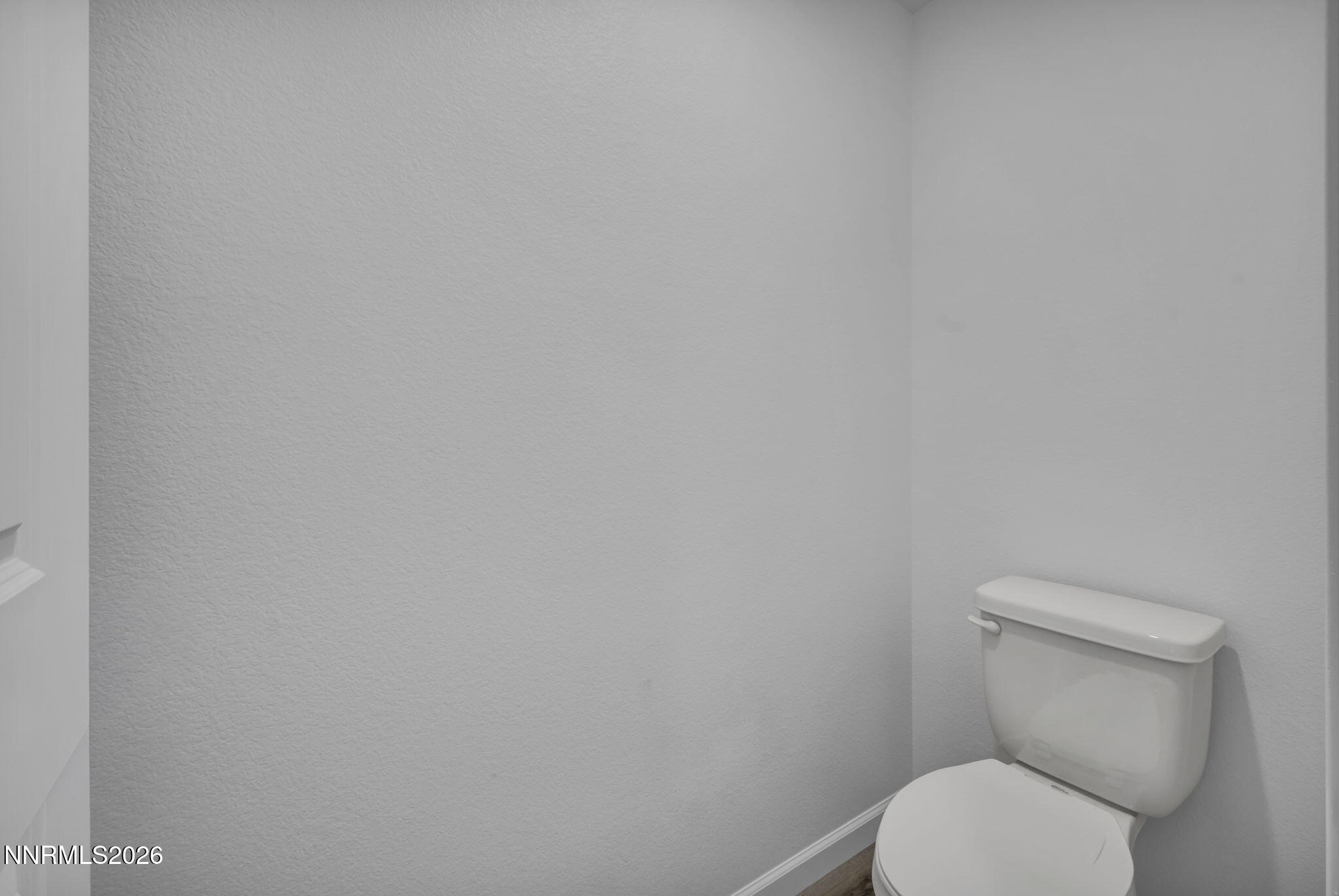 8500 Wicket Drive, Unit LOT 44 Reno, NV 89506 - Photo 24 of 31 a white toilet sitting next to a white wall