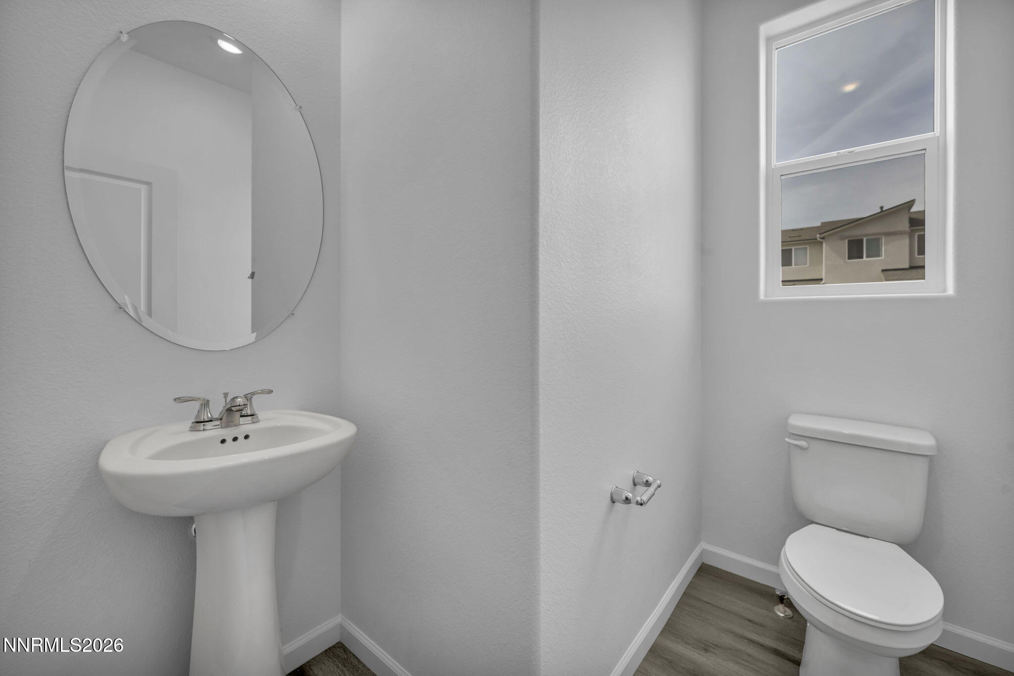 8500 Wicket Drive, Unit LOT 44 Reno, NV 89506 - Photo 25 of 31 a bathroom with a toilet sink and mirror