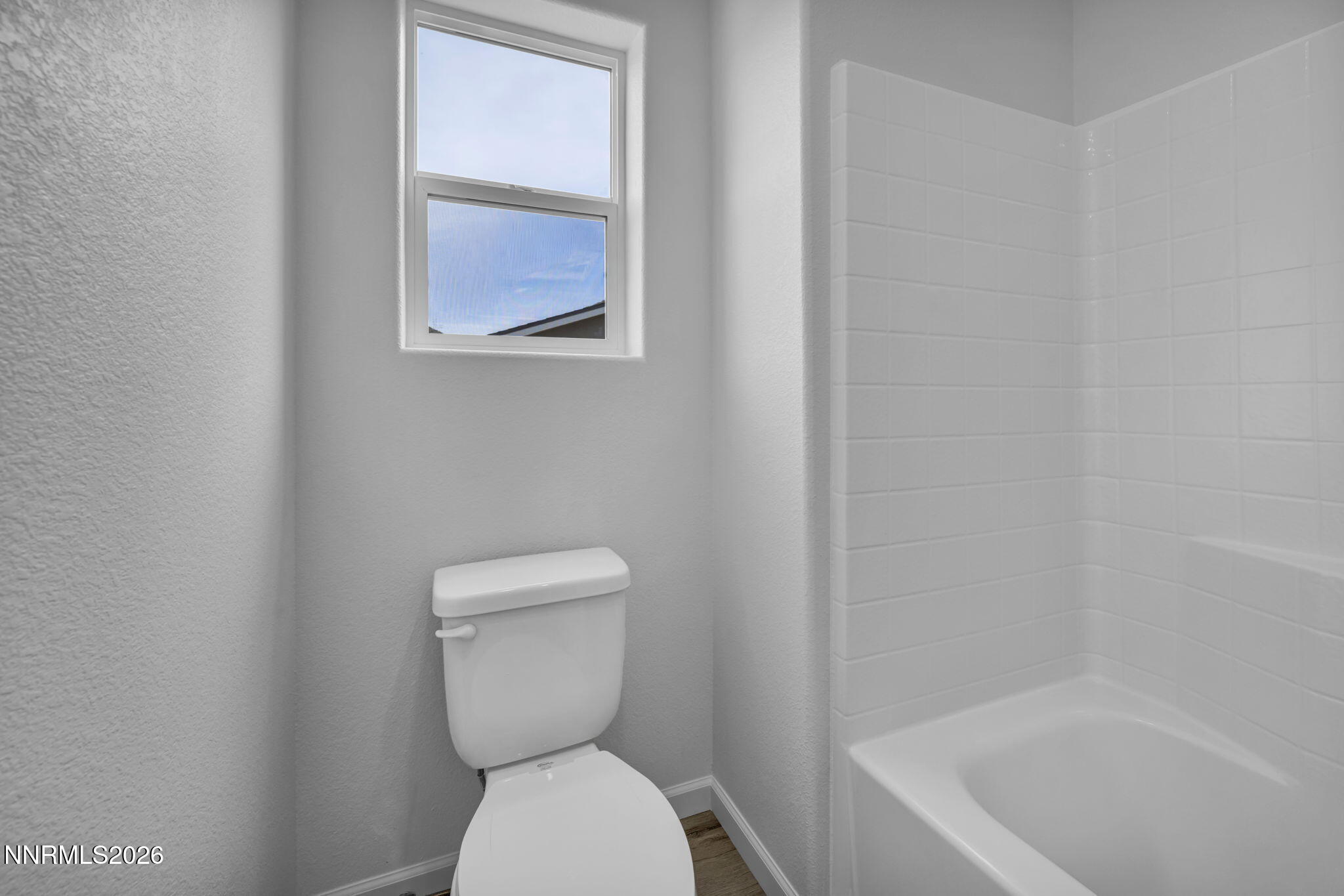 8500 Wicket Drive, Unit LOT 44 Reno, NV 89506 - Photo 26 of 31 a white toilet sitting next to a bath tub