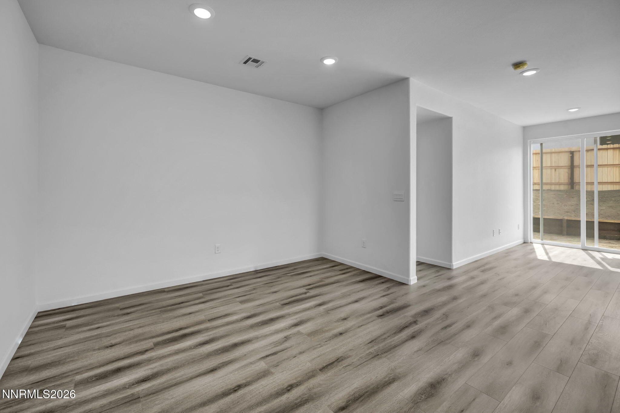 8500 Wicket Drive, Unit LOT 44 Reno, NV 89506 - Photo 3 of 31 a view of an empty room with wooden floor and closet