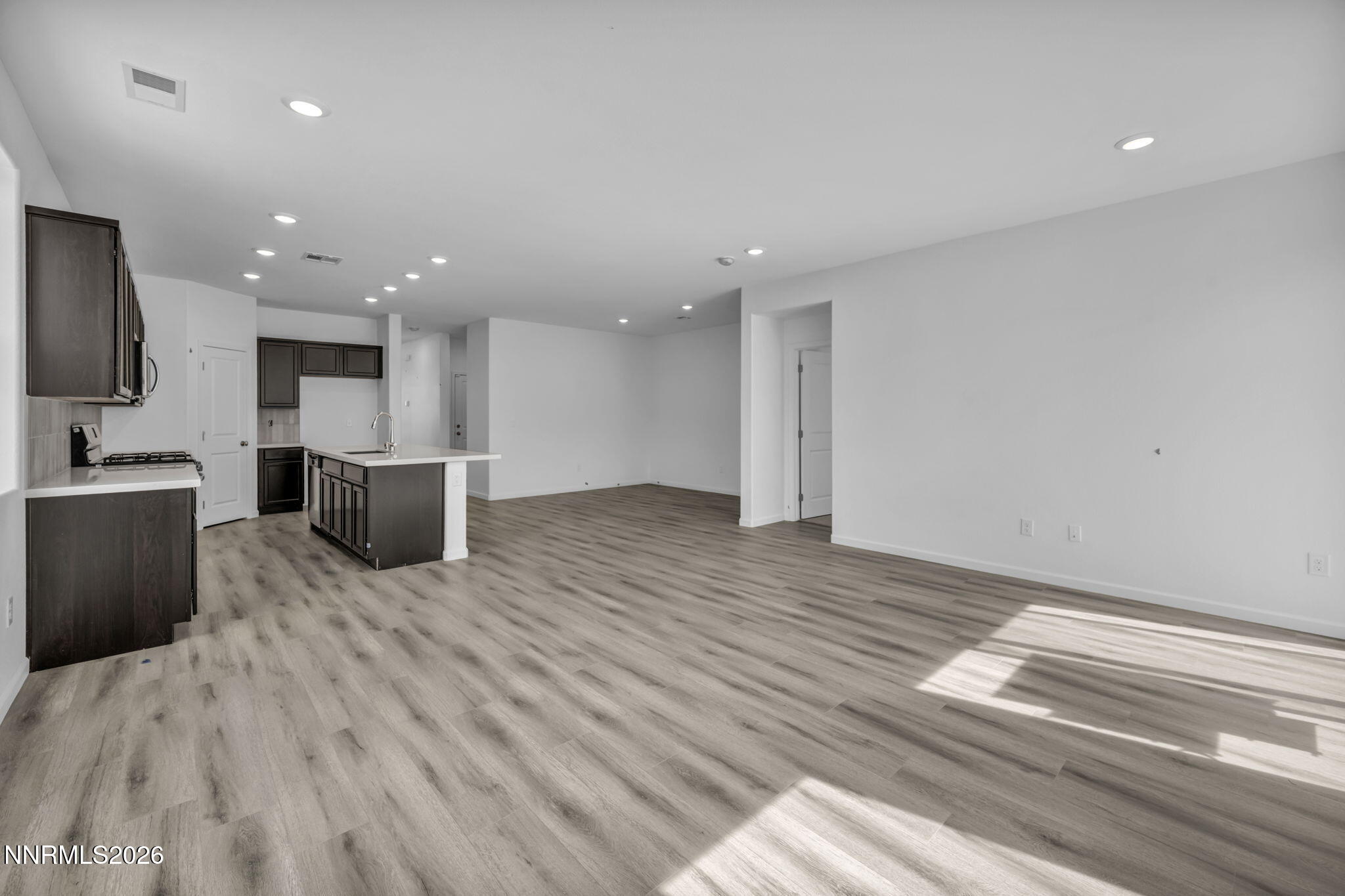 8500 Wicket Drive, Unit LOT 44 Reno, NV 89506 - Photo 6 of 31 a view of kitchen with wooden floor and electronic appliances