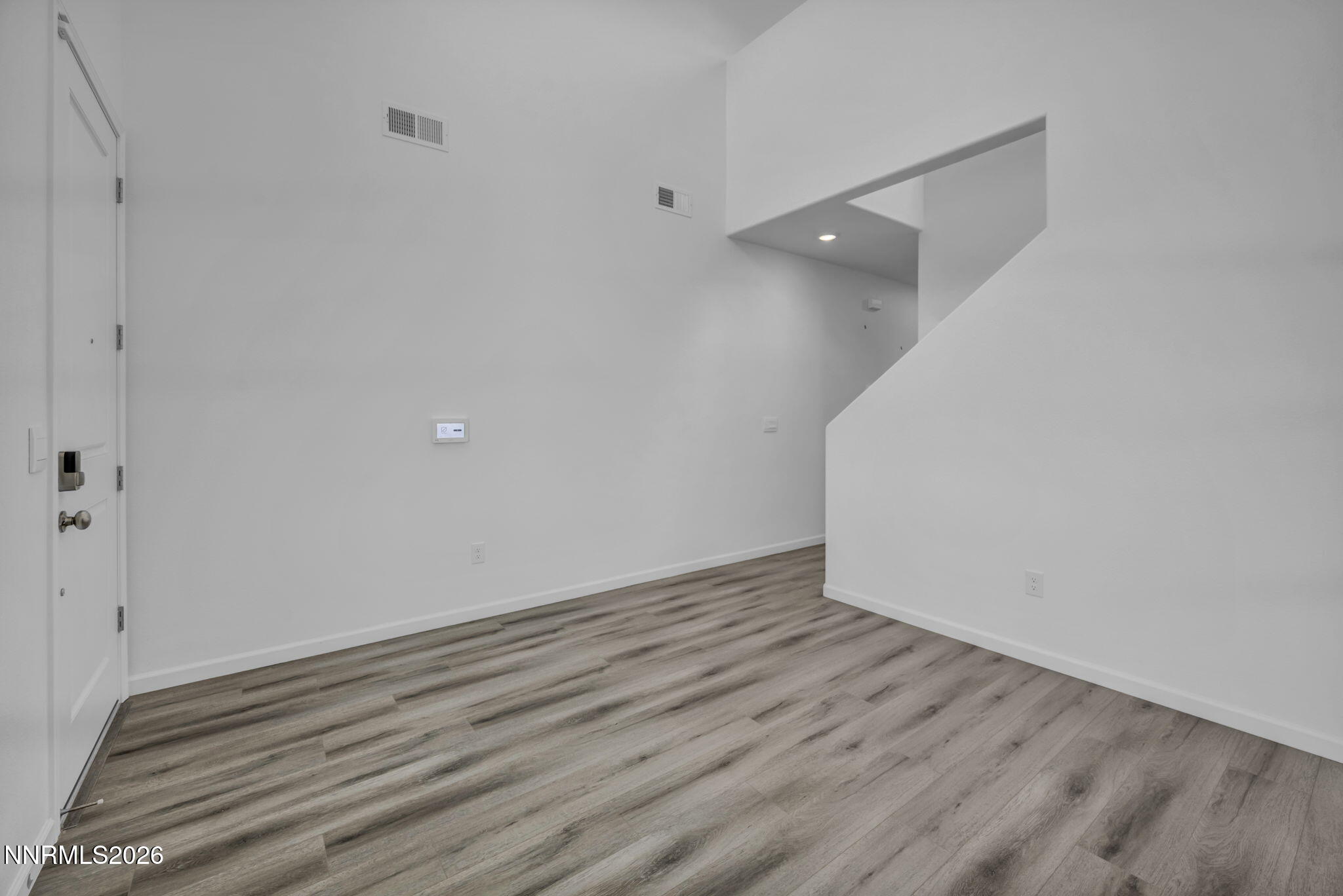8500 Wicket Drive, Unit LOT 44 Reno, NV 89506 - Photo 8 of 31 a view of an empty room with wooden floor and closet