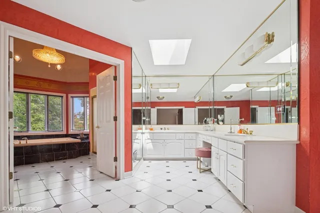 a kitchen with stainless steel appliances a stove a sink and a refrigerator