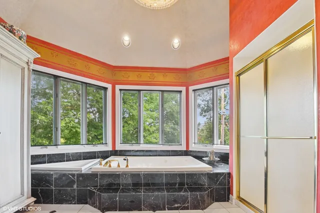 a front view of a house with a large window