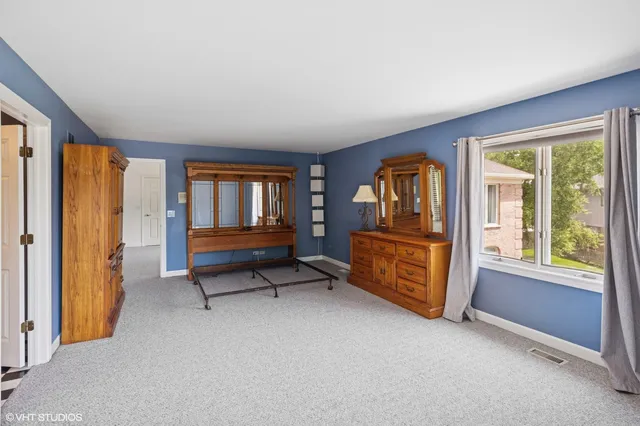 a view of a patio with furniture and wooden floor