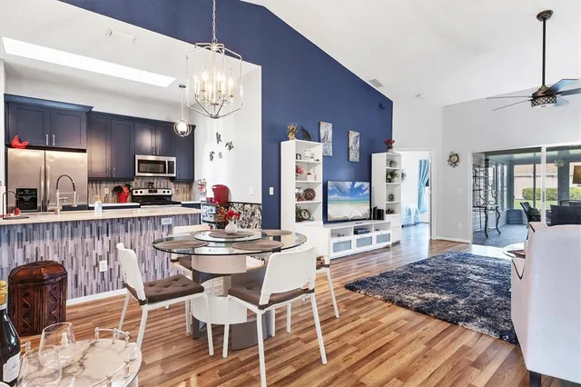 a view of a dining room with furniture and wooden floor