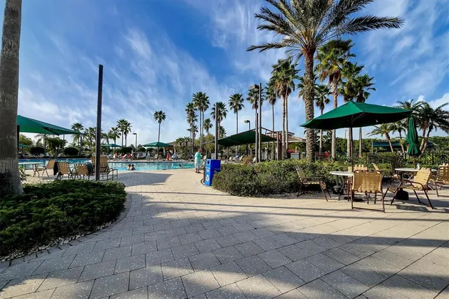 a view of a chairs and tables in patio