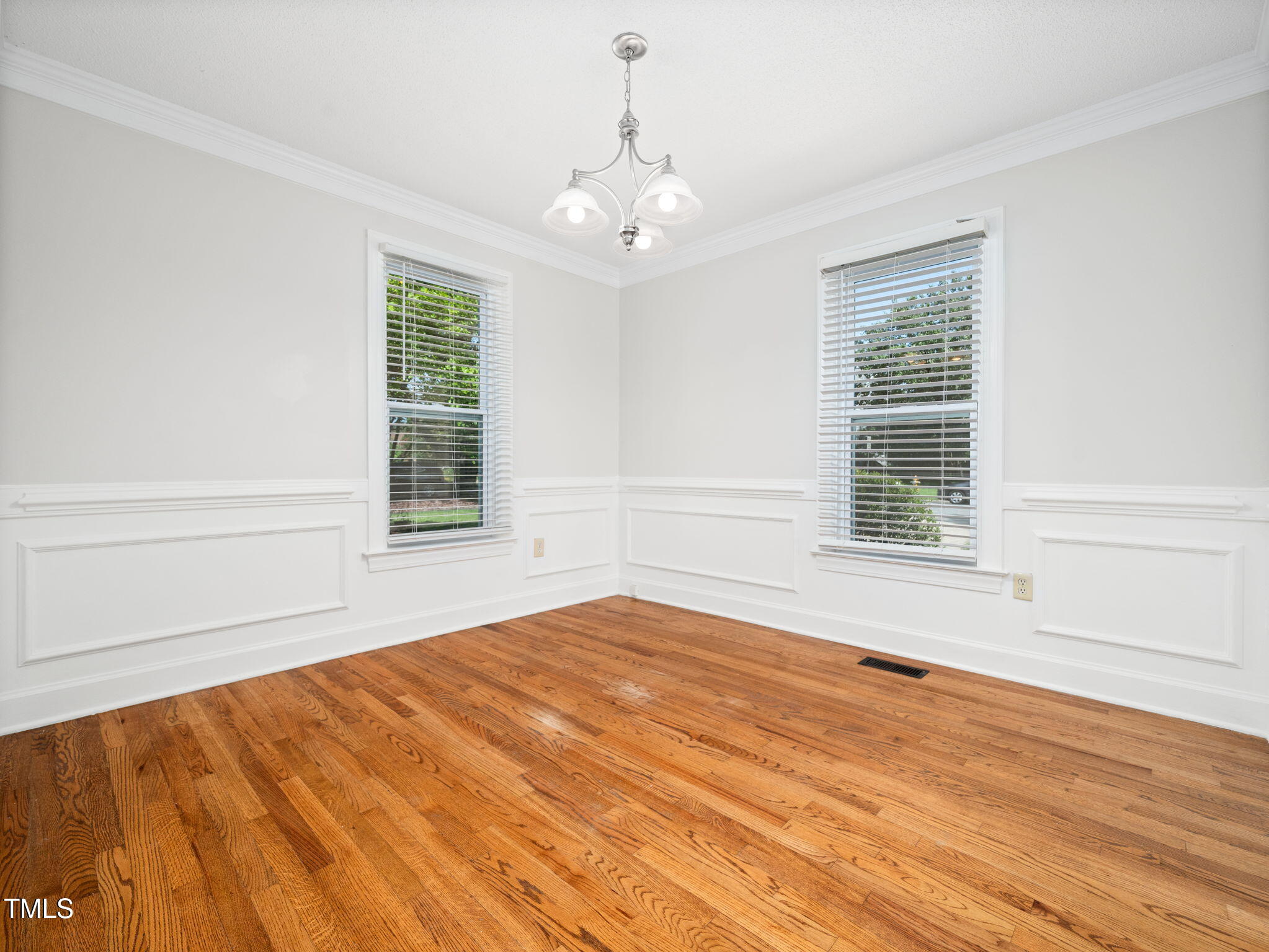 3909 Iron Horse Road Raleigh, NC 27616 - Photo 13 of 47 a view of an empty room with wooden floor and a window