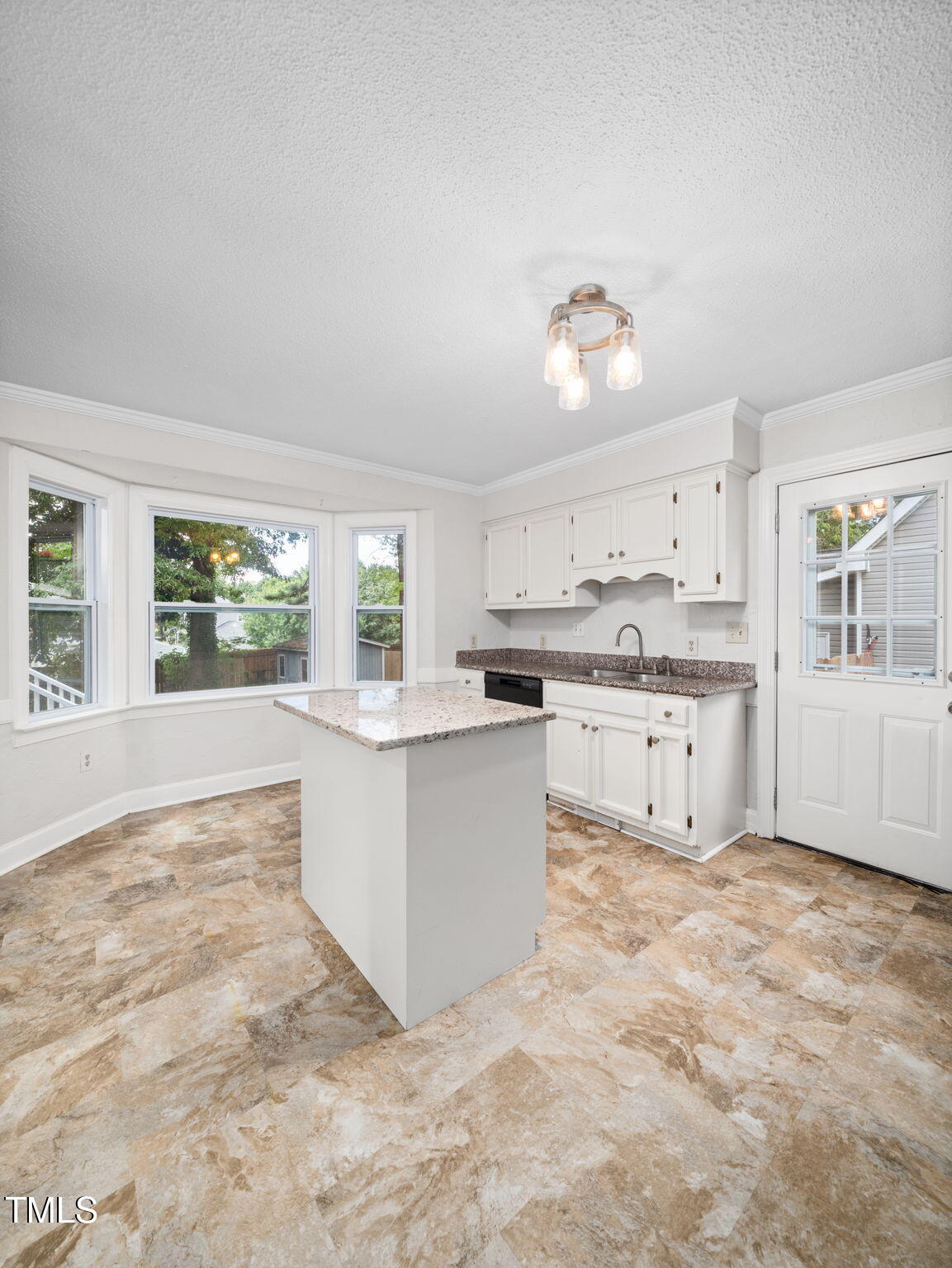 3909 Iron Horse Road Raleigh, NC 27616 - Photo 20 of 47 a large white kitchen with a stove a sink dishwasher and a refrigerator