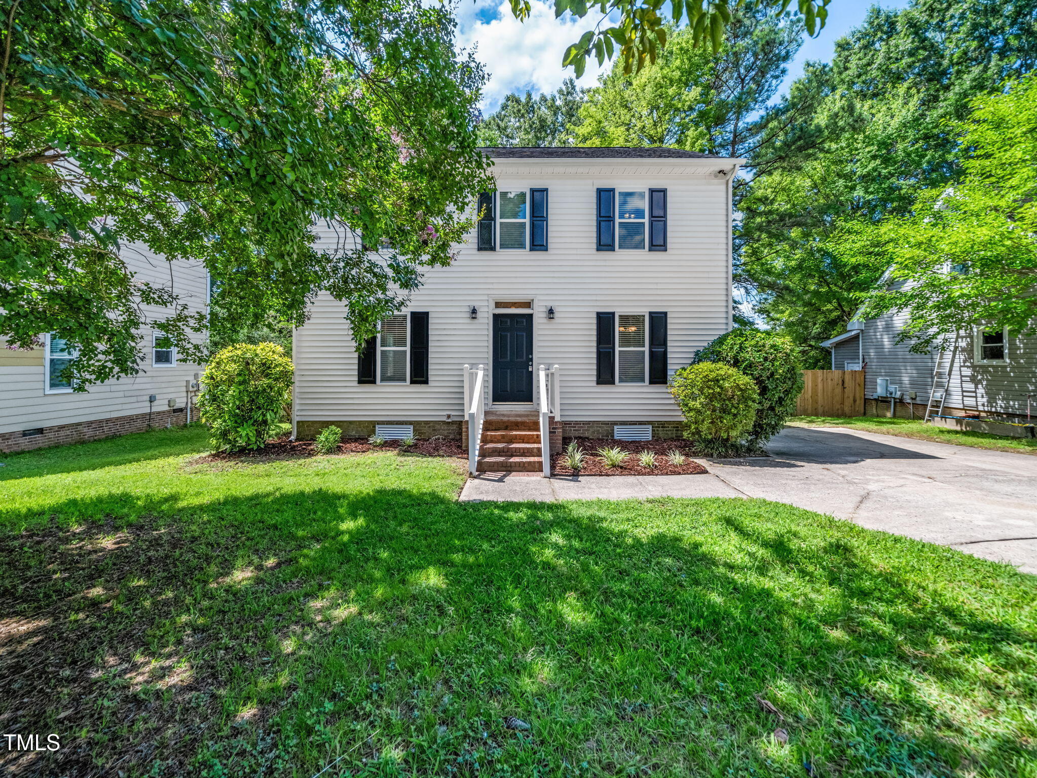 3909 Iron Horse Road Raleigh, NC 27616 - Photo 2 of 47 a house view with a garden space