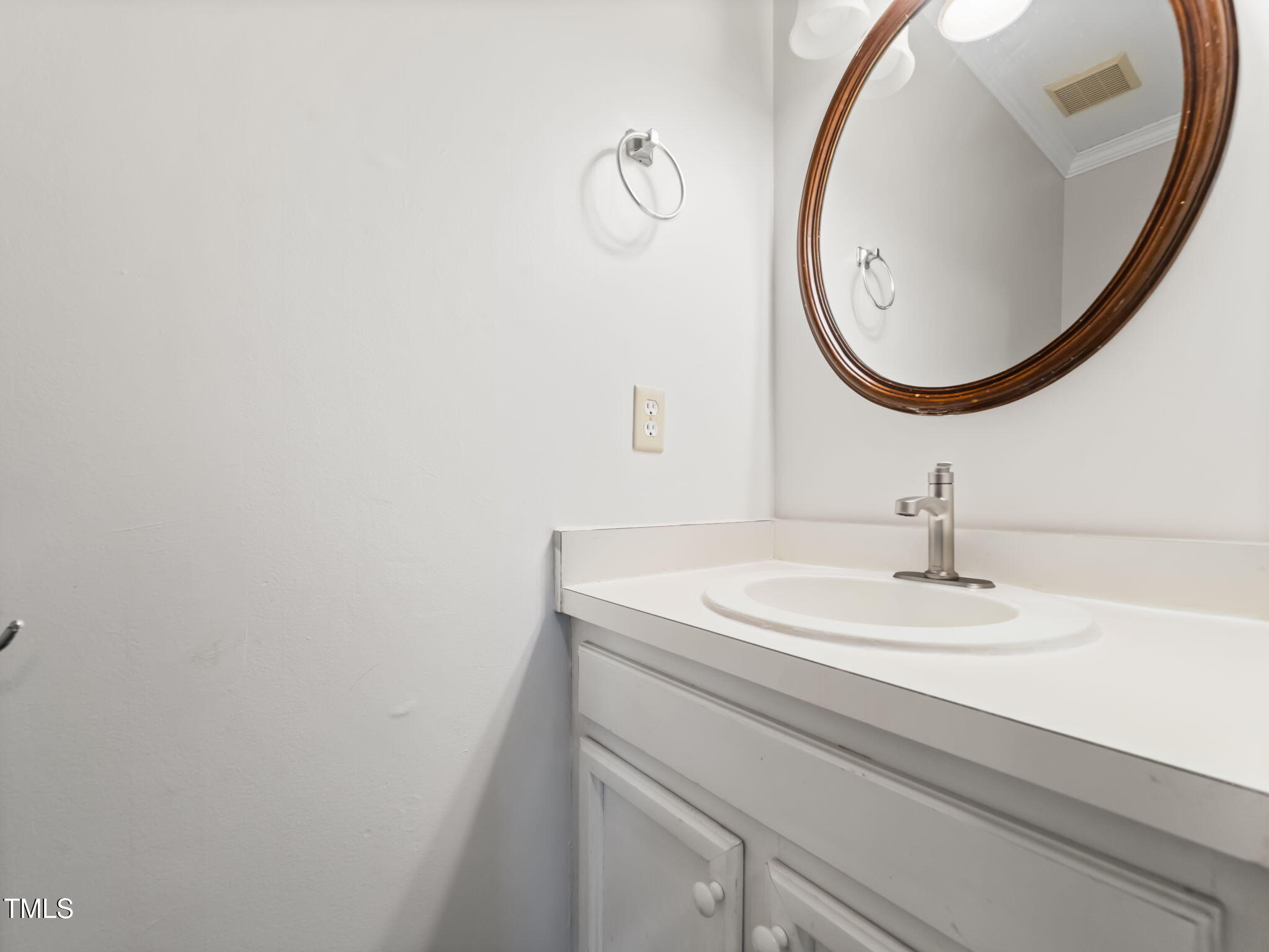3909 Iron Horse Road Raleigh, NC 27616 - Photo 23 of 47 a bathroom with a sink and a mirror