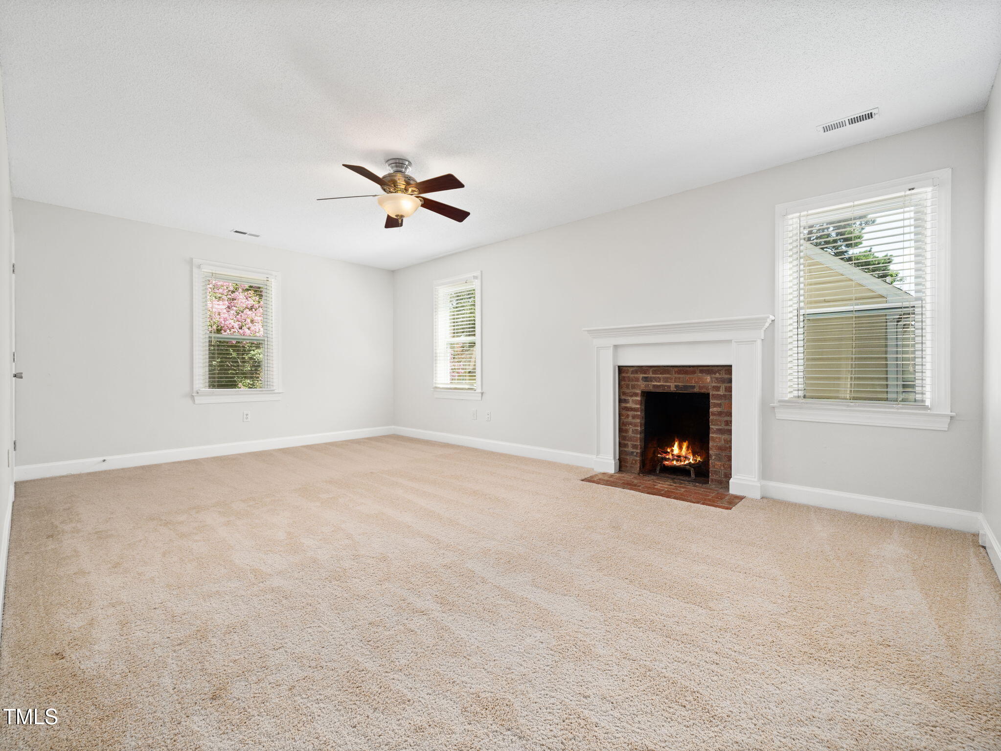 3909 Iron Horse Road Raleigh, NC 27616 - Photo 25 of 47 a view of empty room with a fireplace