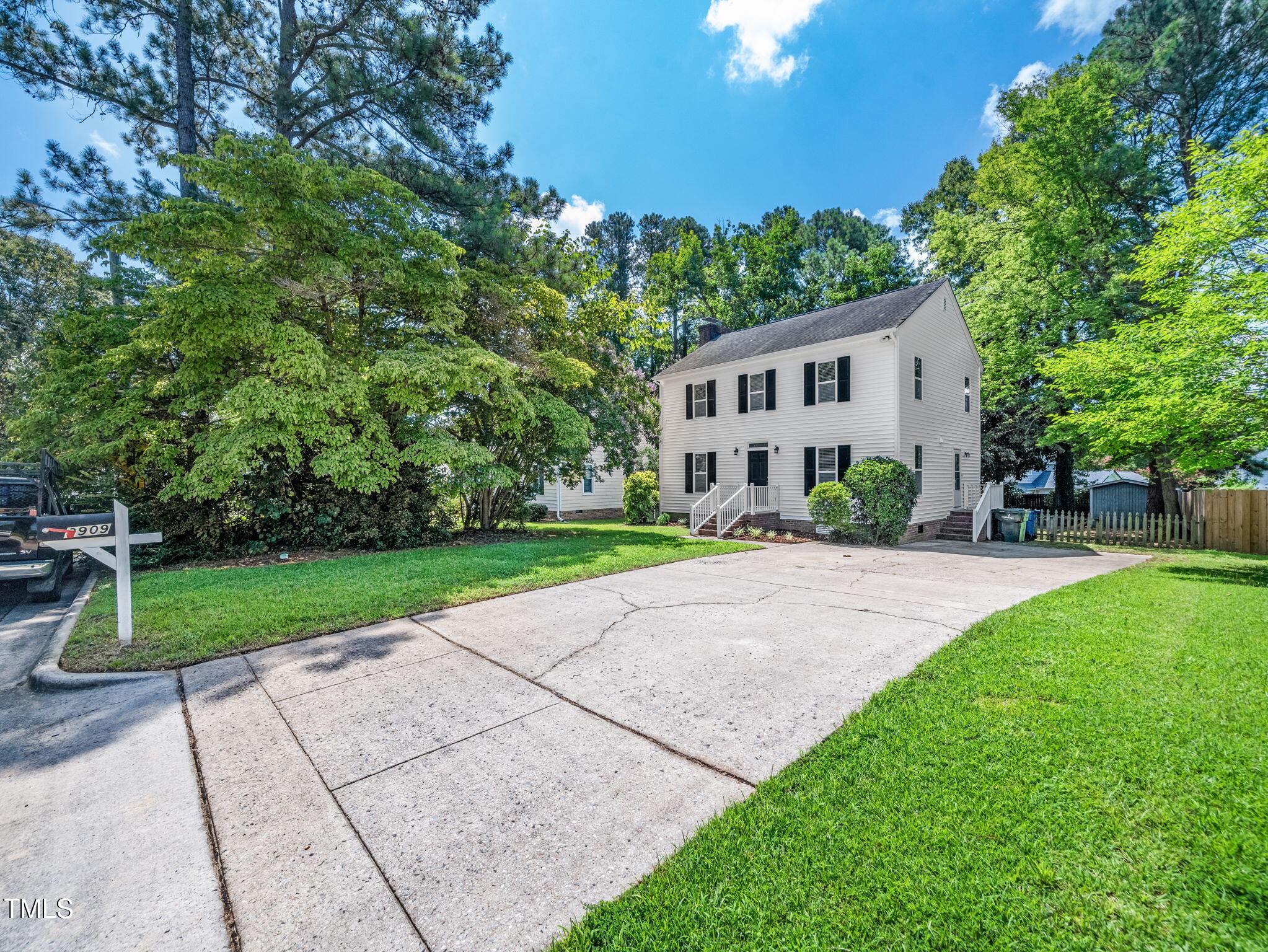3909 Iron Horse Road Raleigh, NC 27616 - Photo 3 of 47 a house with green field in front of it