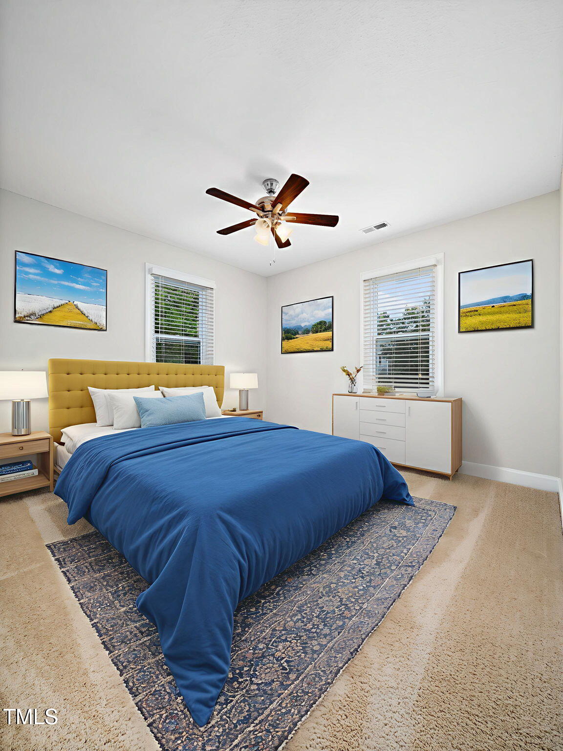 3909 Iron Horse Road Raleigh, NC 27616 - Photo 41 of 47 a bedroom with a large bed and a chandelier