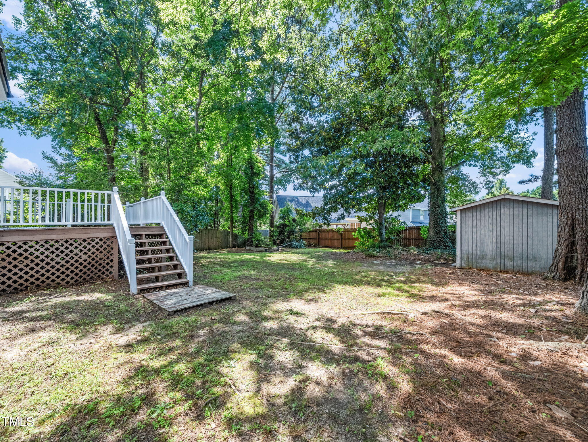 3909 Iron Horse Road Raleigh, NC 27616 - Photo 44 of 47 a view of a backyard with a tree