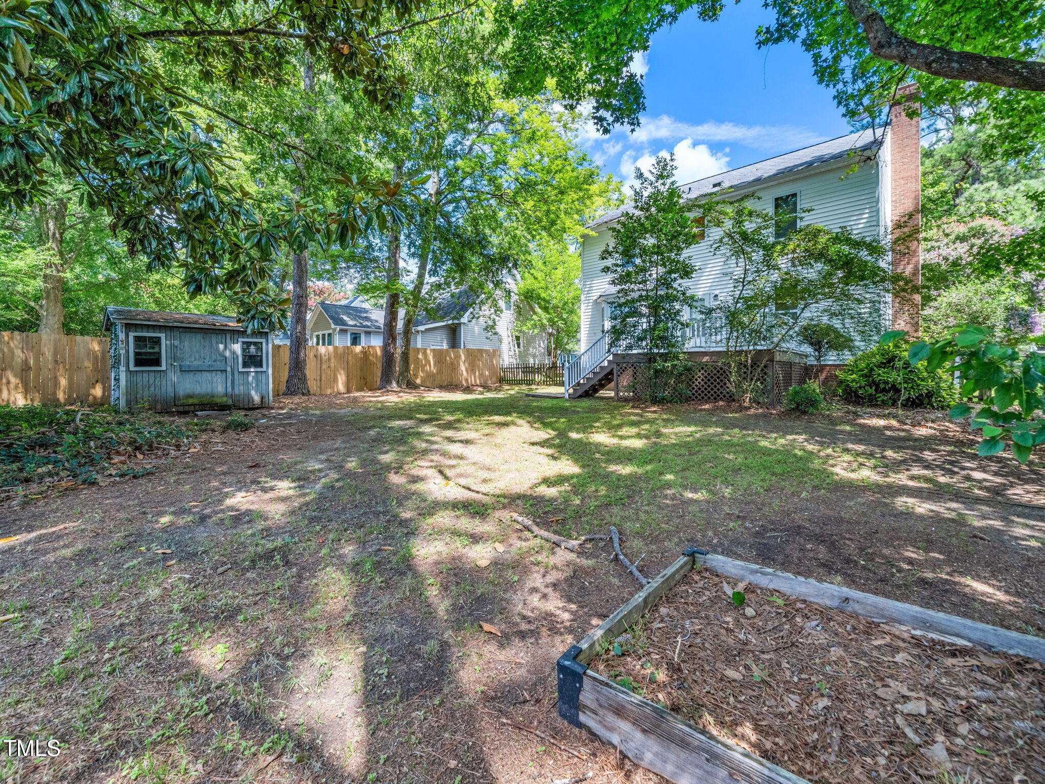 3909 Iron Horse Road Raleigh, NC 27616 - Photo 46 of 47 a view of a backyard with a garden