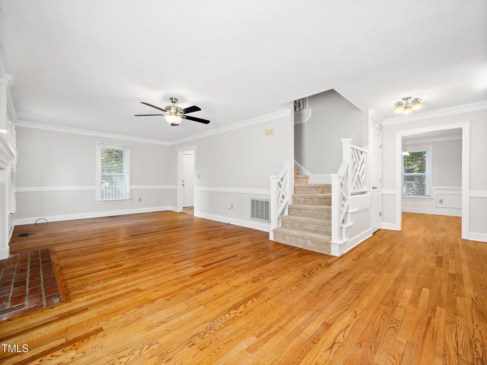 3909 Iron Horse Road Raleigh, NC 27616 - Photo 10 of 47 a view of a bedroom with wooden floor and white walls