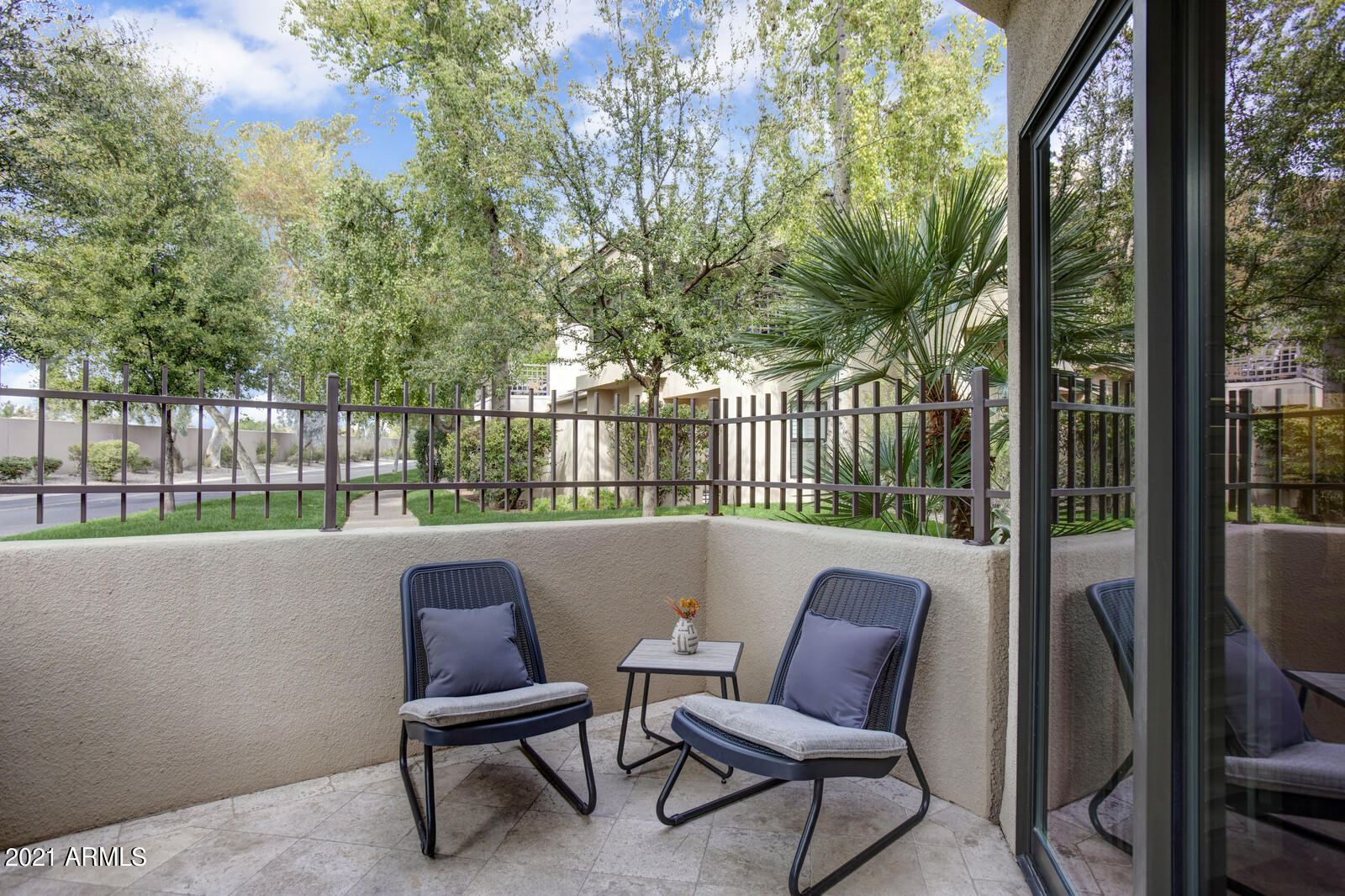 7272 East Gainey Ranch Road, Unit 85 Scottsdale, AZ 85258 - Photo 25 of 37 a view of a chair and tables in the yard