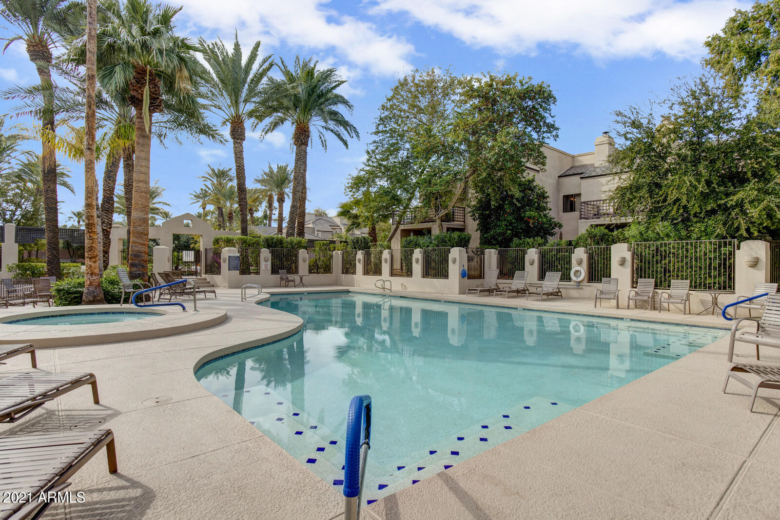 7272 East Gainey Ranch Road, Unit 85 Scottsdale, AZ 85258 - Photo 31 of 37 a view of swimming pool with a table and chairs