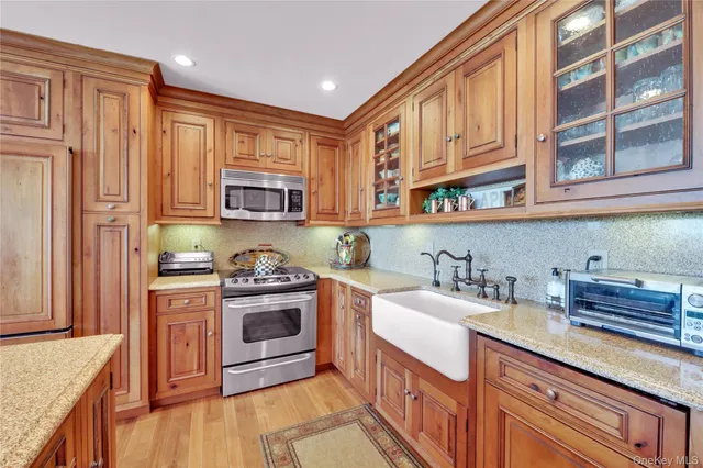 a kitchen with stainless steel appliances granite countertop a stove and a sink