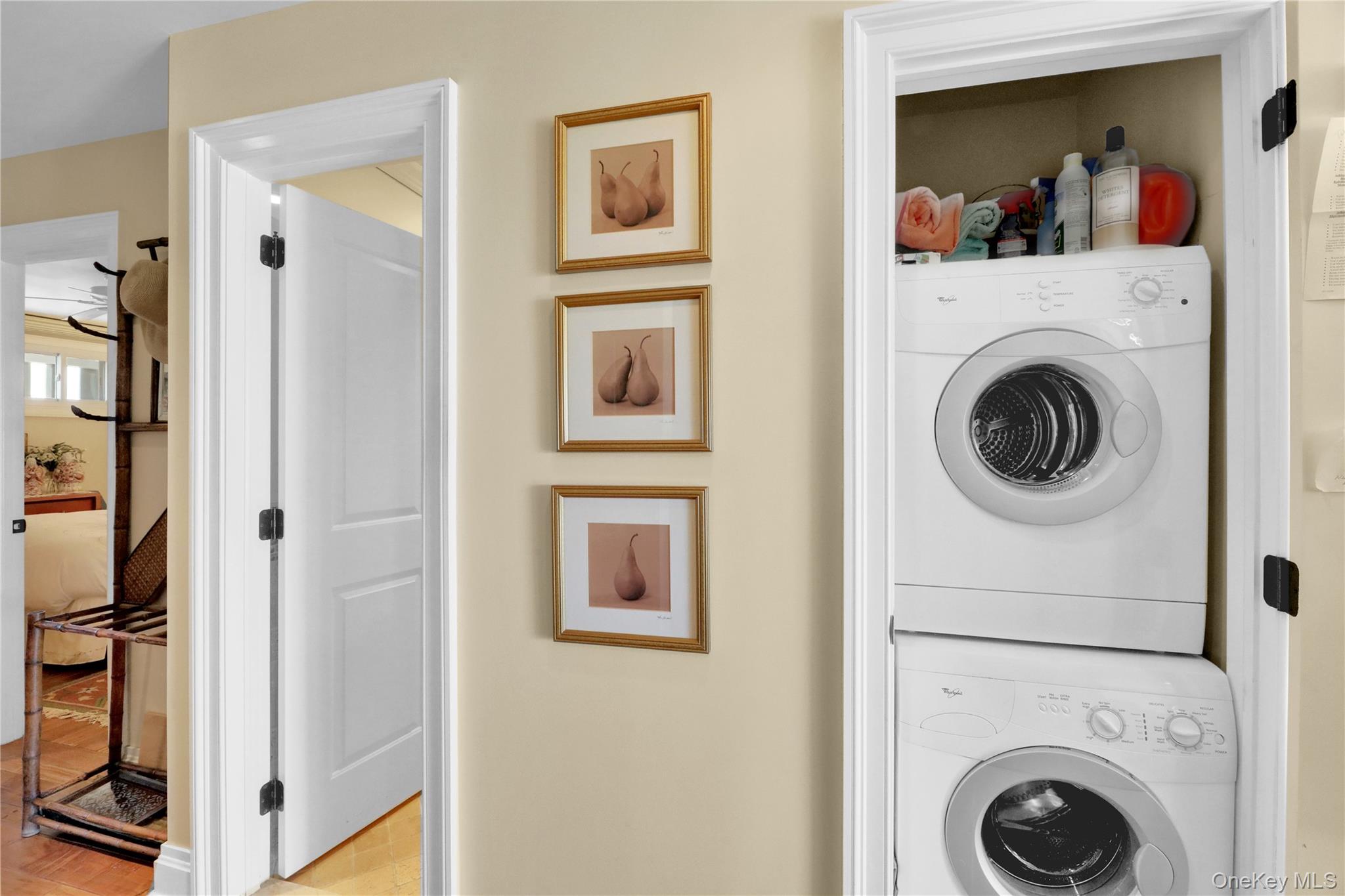 279 Dune Road, Unit 2 Westhampton Beach, NY 11978 - Photo 19 of 45 a view of a hallway with washer and dryer