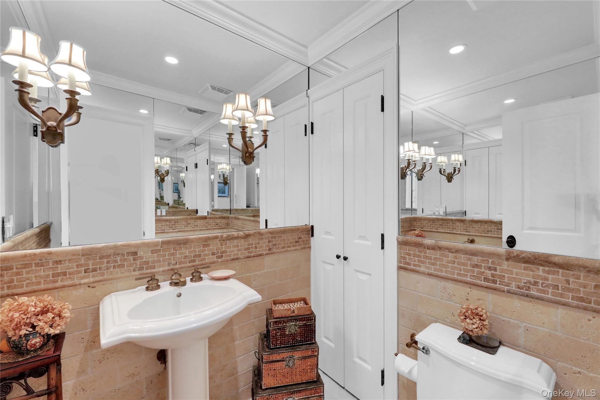 279 Dune Road, Unit 2 Westhampton Beach, NY 11978 - Photo 20 of 45 a bathroom with a sink double vanity and a mirror