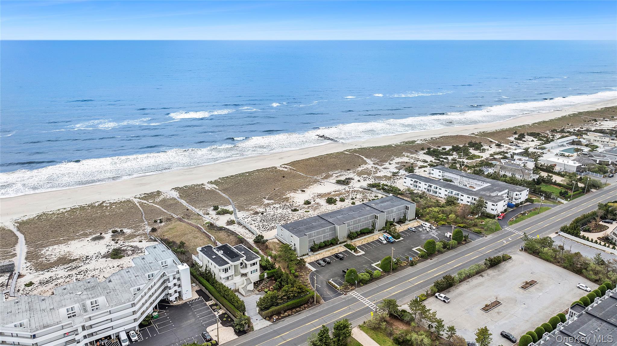 279 Dune Road, Unit 2 Westhampton Beach, NY 11978 - Photo 2 of 45 a view of an ocean beach