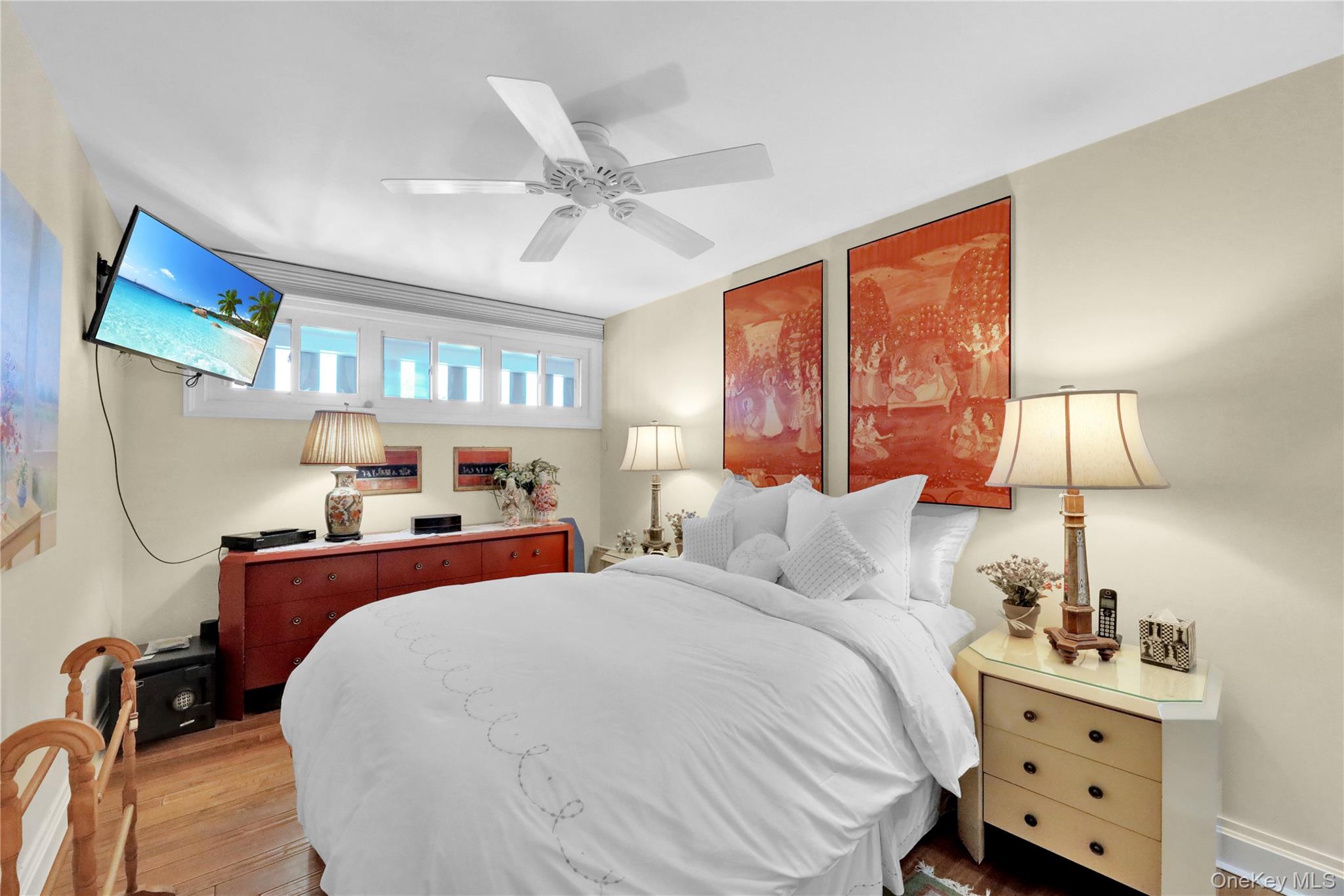 279 Dune Road, Unit 2 Westhampton Beach, NY 11978 - Photo 21 of 45 a bedroom with double bed and a window