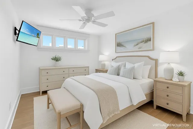 a spacious bedroom with a bed and a painting on the wall