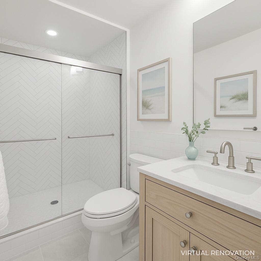 279 Dune Road, Unit 2 Westhampton Beach, NY 11978 - Photo 25 of 45 a bathroom with a sink a toilet and shower