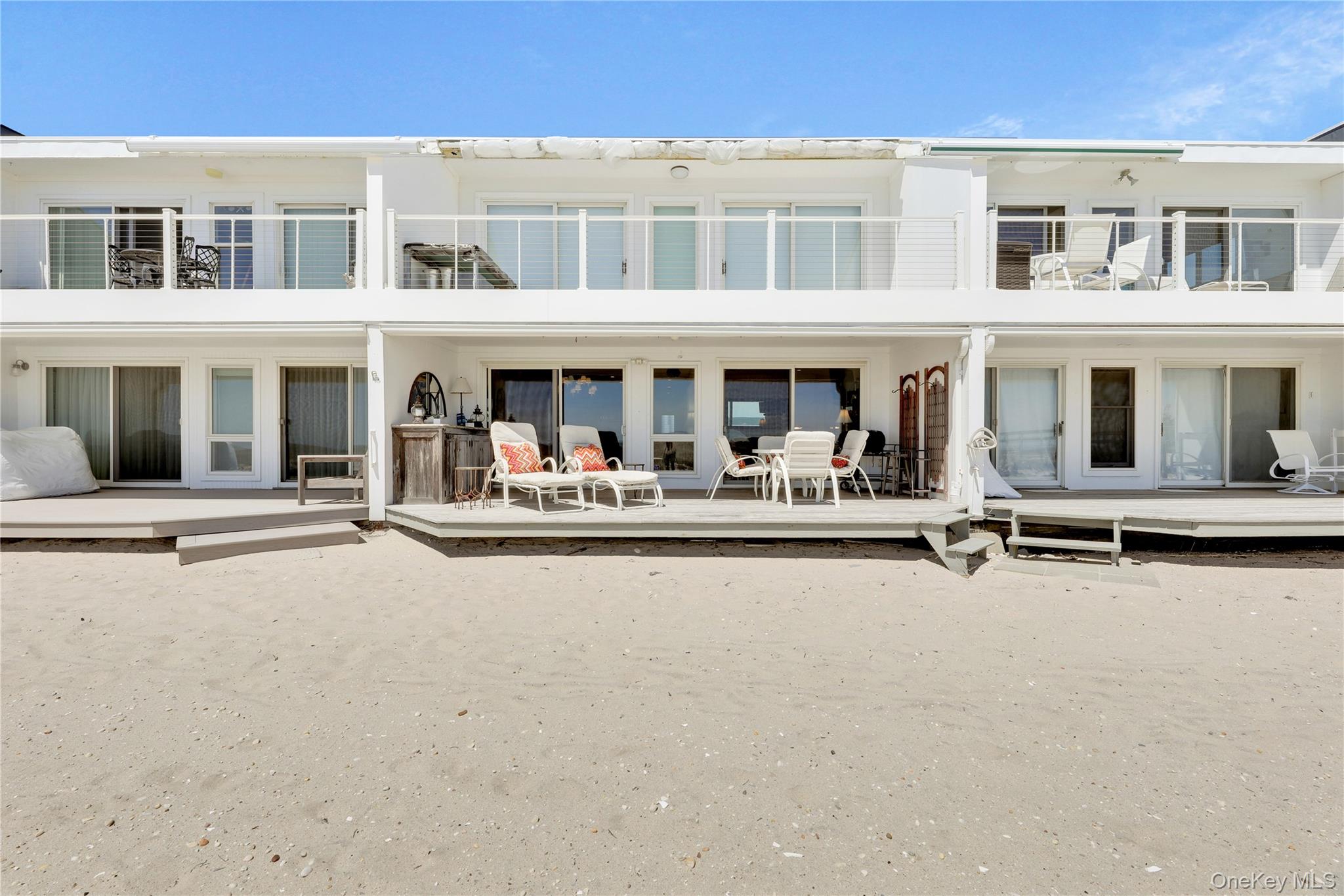 279 Dune Road, Unit 2 Westhampton Beach, NY 11978 - Photo 32 of 45 front view of a building with a street