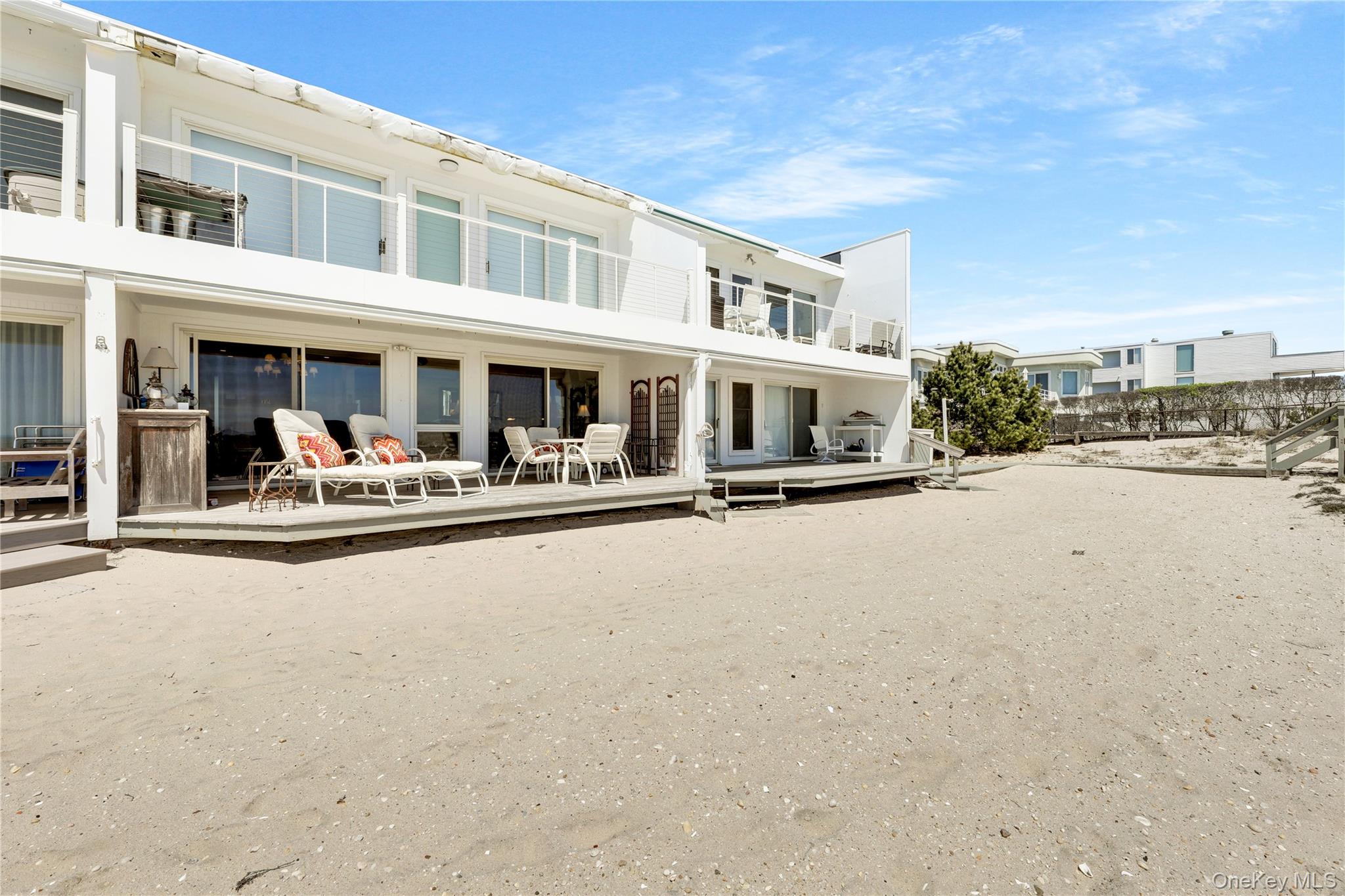 279 Dune Road, Unit 2 Westhampton Beach, NY 11978 - Photo 33 of 45 a view of a street with cars