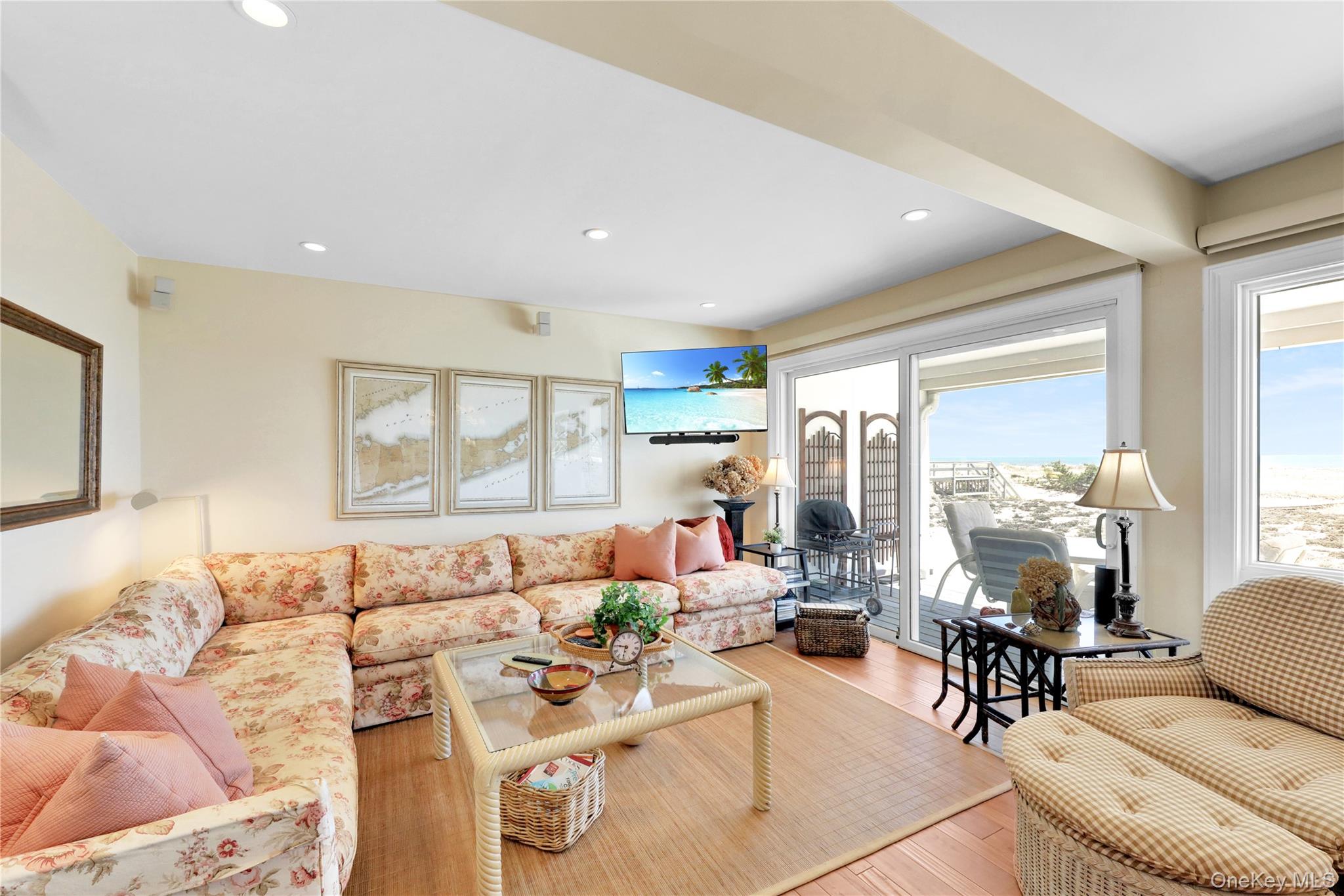 279 Dune Road, Unit 2 Westhampton Beach, NY 11978 - Photo 10 of 45 a living room with furniture and a large window