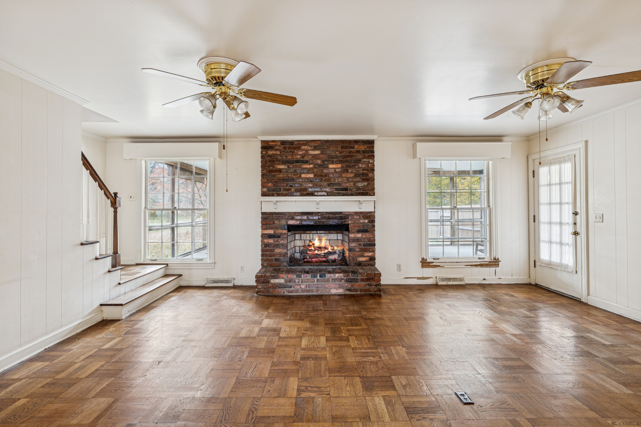 718 Murfreesboro Road Franklin, TN 37064 - Photo 14 of 35 a view of an empty room with a fireplace and a window