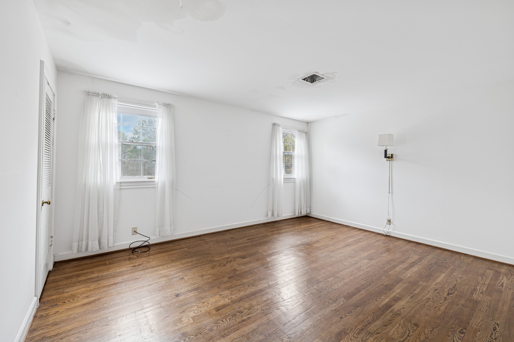 718 Murfreesboro Road Franklin, TN 37064 - Photo 23 of 35 a view of an empty room with wooden floor and a window