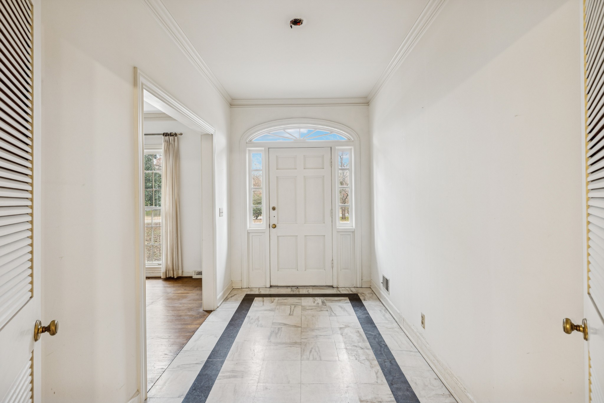 718 Murfreesboro Road Franklin, TN 37064 - Photo 4 of 35 a view of a room with wooden floor and a bathroom