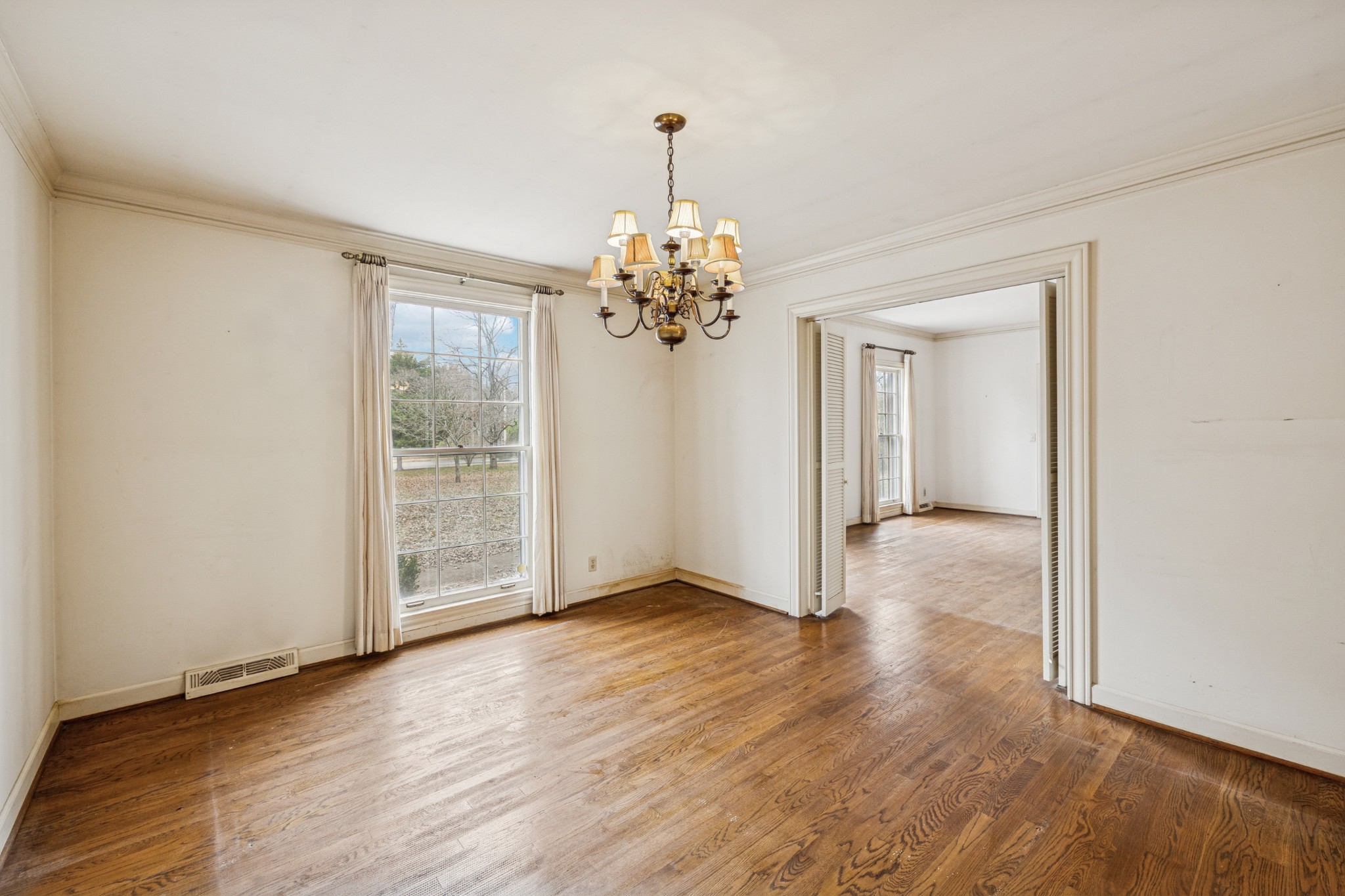 718 Murfreesboro Road Franklin, TN 37064 - Photo 7 of 35 a view of a room with wooden floor chandelier and window