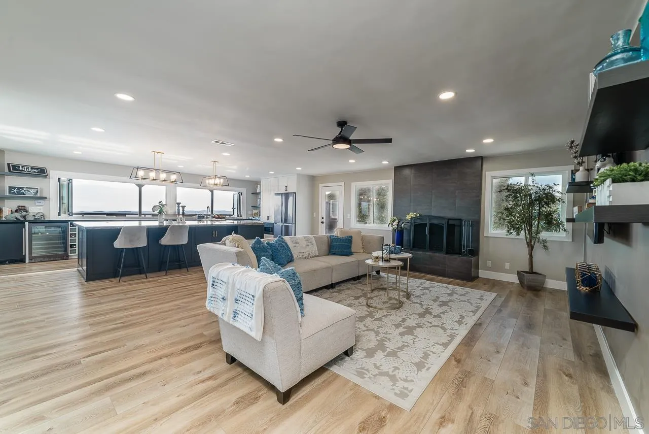 1647 Sleeping Indian Road Fallbrook, CA 92028 - Photo 18 of 48 a living room with furniture wooden floor and a flat screen tv
