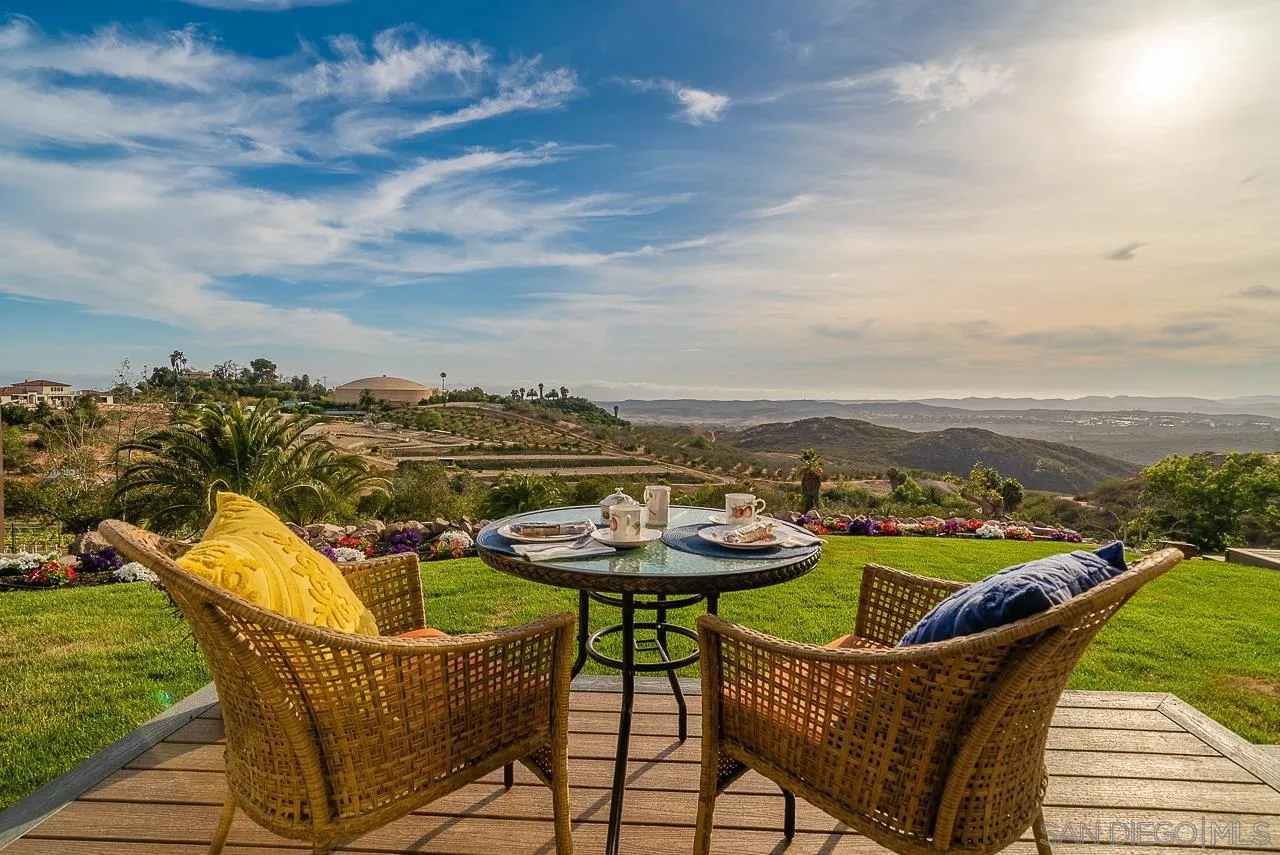 1647 Sleeping Indian Road Fallbrook, CA 92028 - Photo 21 of 48 a view of a chairs and table on the terrace