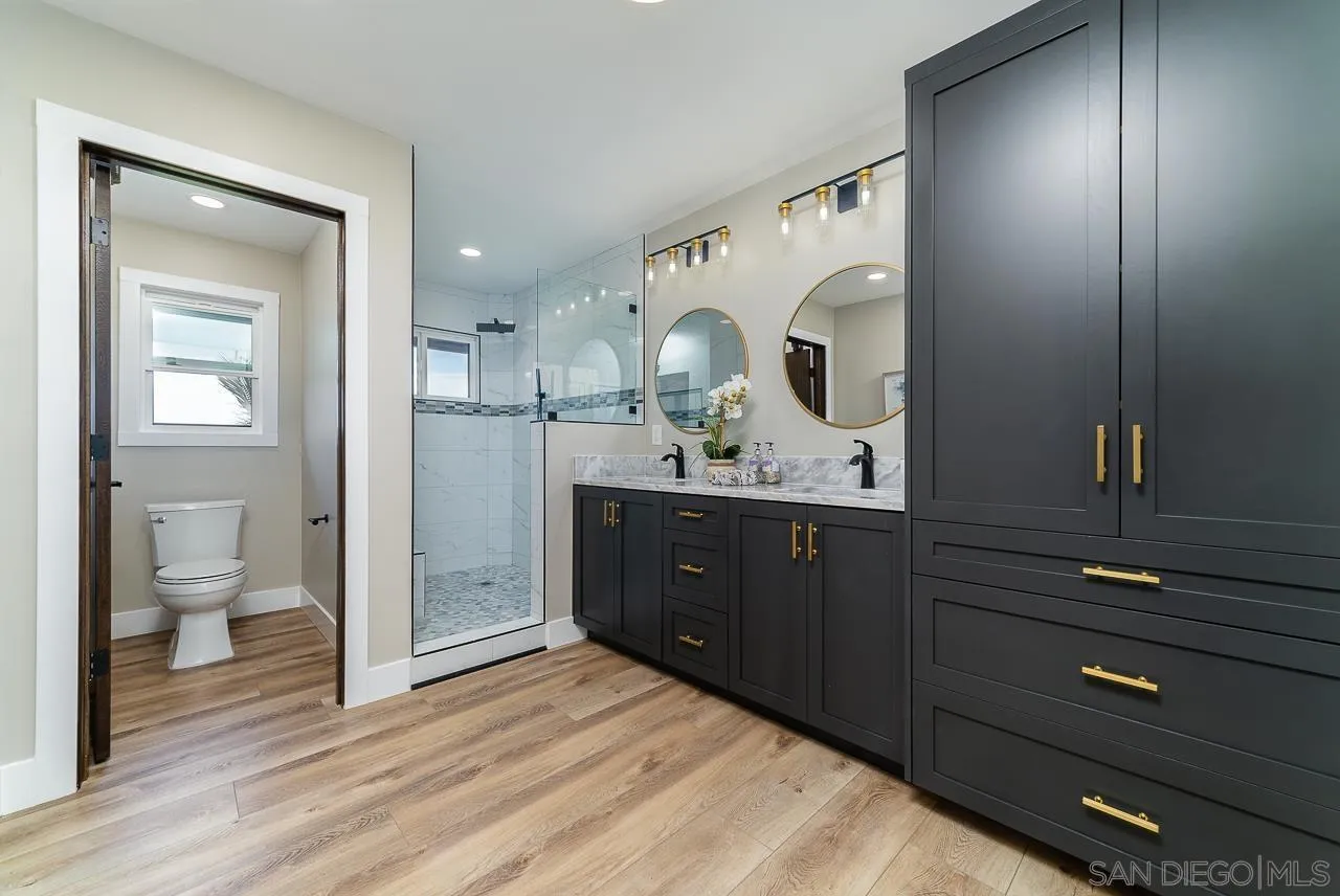1647 Sleeping Indian Road Fallbrook, CA 92028 - Photo 22 of 48 a bathroom with a sink vanity and a mirror