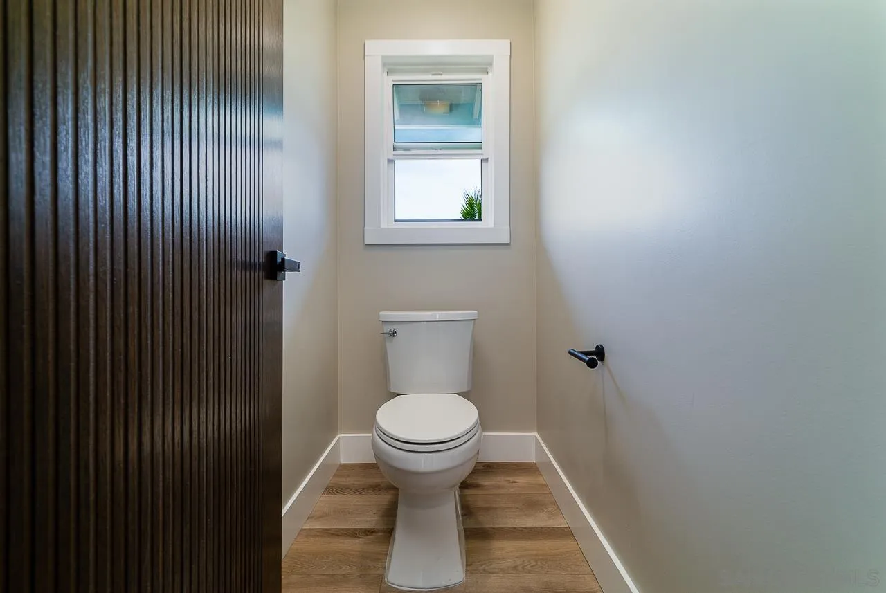 1647 Sleeping Indian Road Fallbrook, CA 92028 - Photo 24 of 48 a bathroom with a toilet and a sink