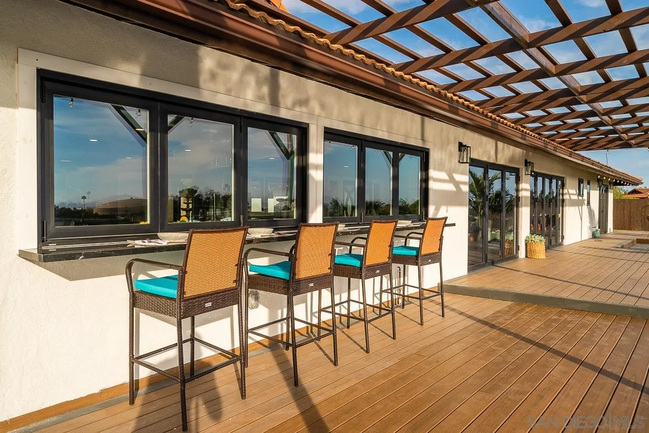 1647 Sleeping Indian Road Fallbrook, CA 92028 - Photo 32 of 48 a view of living room with furniture and floor to ceiling window
