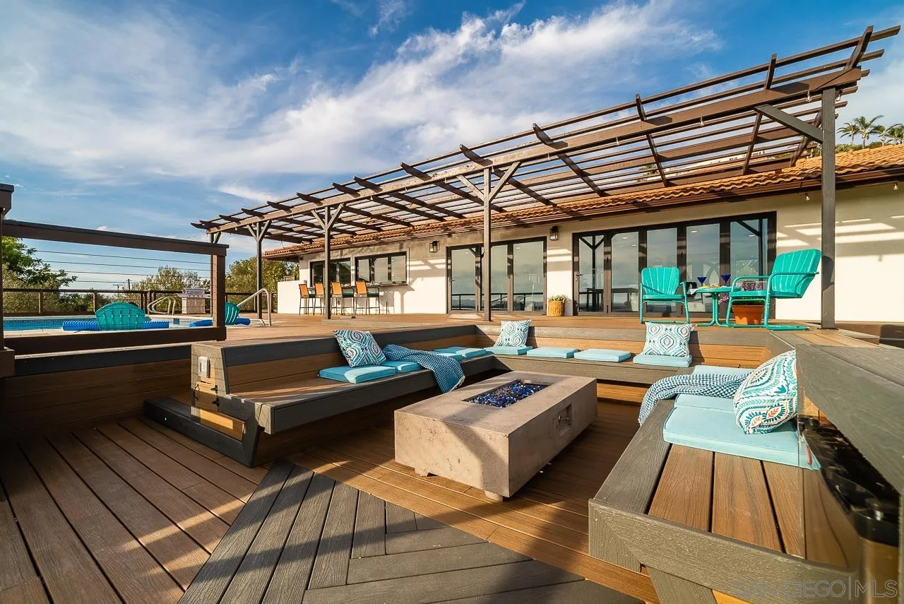 1647 Sleeping Indian Road Fallbrook, CA 92028 - Photo 34 of 48 a view of a patio with couches table and chairs with wooden floor