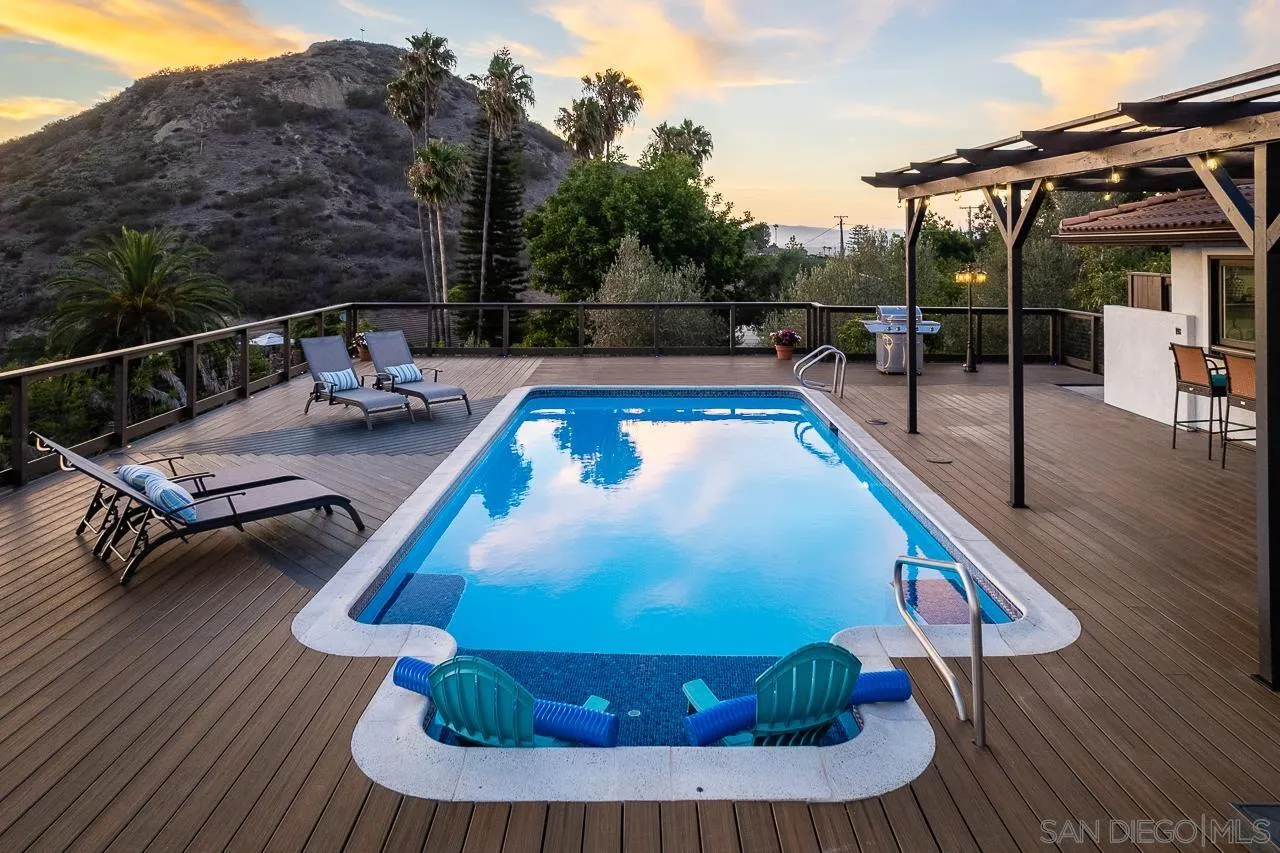 1647 Sleeping Indian Road Fallbrook, CA 92028 - Photo 35 of 48 a view of a swimming pool with lounge chair