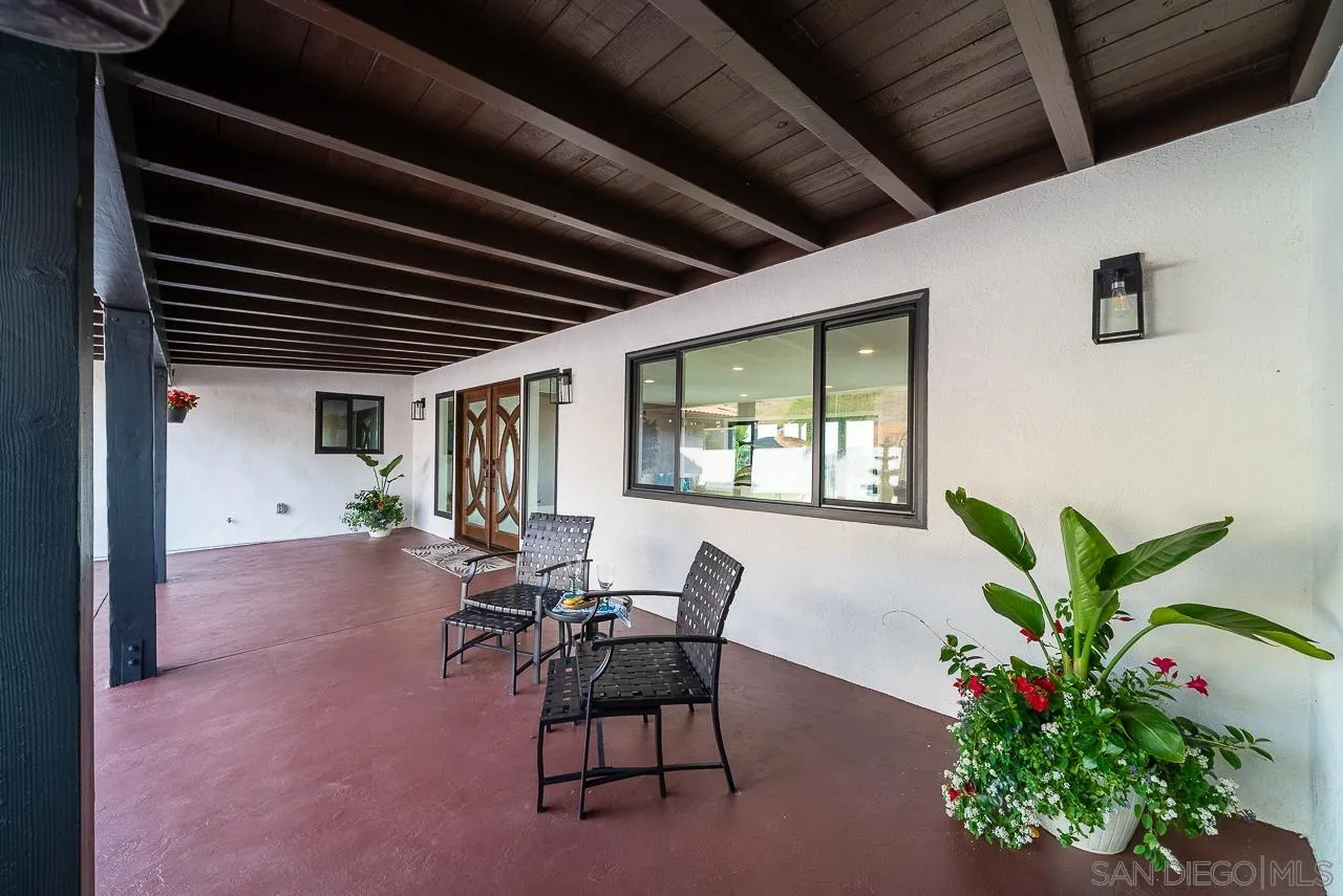 1647 Sleeping Indian Road Fallbrook, CA 92028 - Photo 46 of 48 a view of a porch with chairs and potted plants