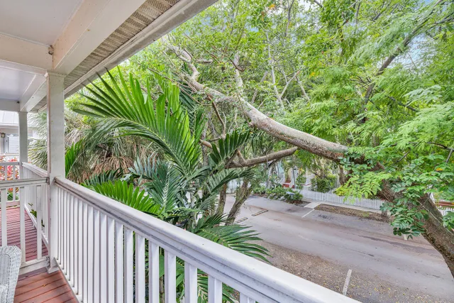 a view of a garden from a balcony