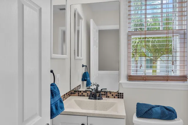 a bathroom with a sink and a window