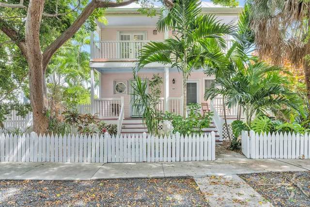 front view of a house with a fence
